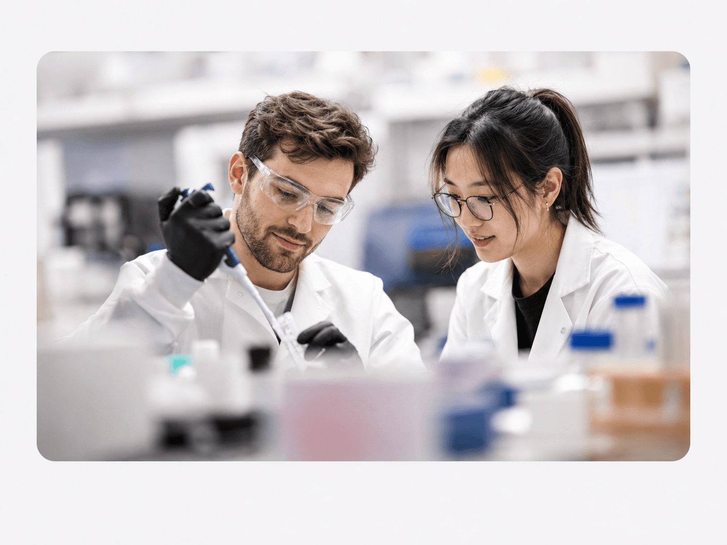 Two scientists working together in a pharmaceutical laboratory