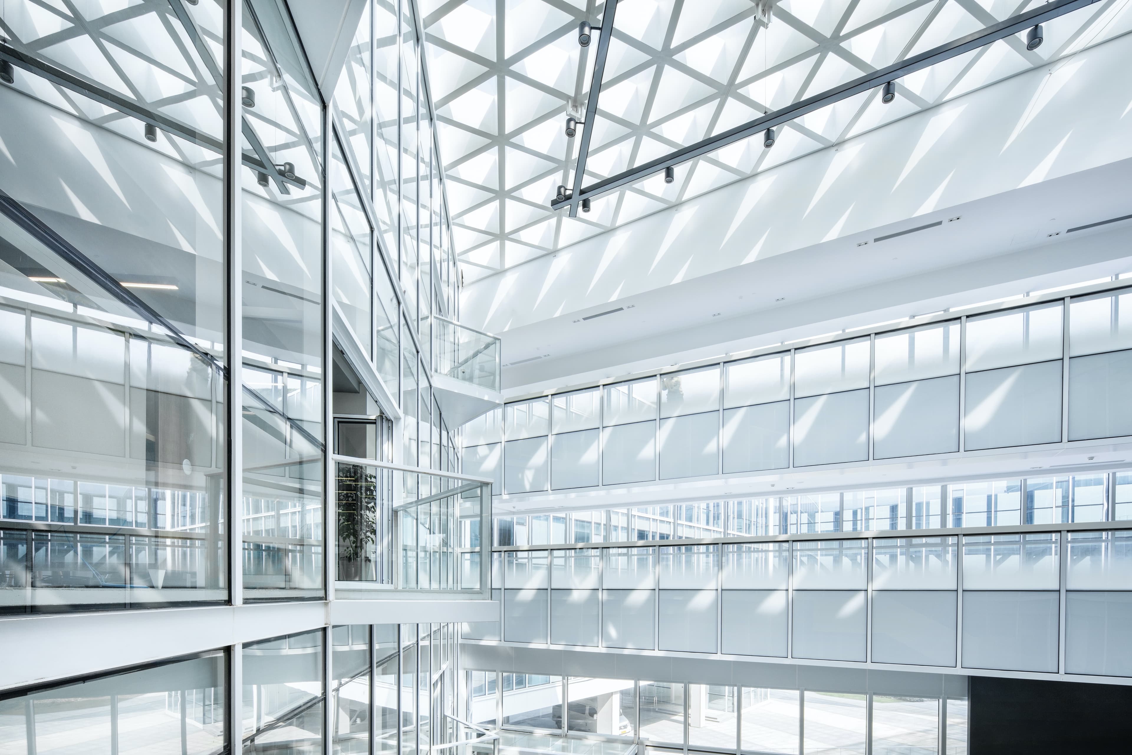 Light-filled modern glass building interior